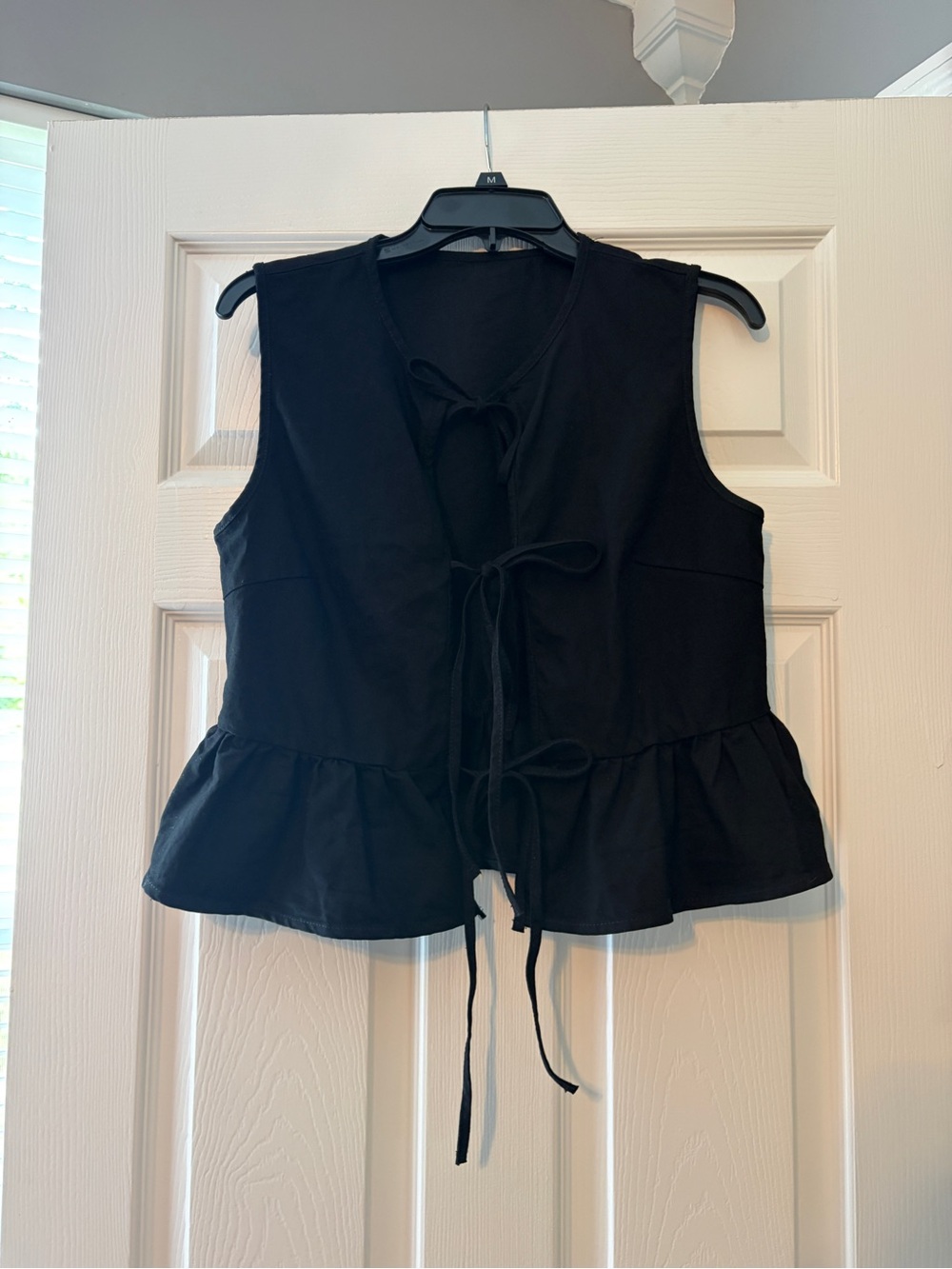 Black Tie-Front Peplum Sleeveless Top